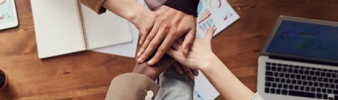 Photo Of People Near Wooden Table